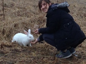 Here I am feeding one of the bunnies that hops freely around White Point Beach Resort in Nova Scotia, Canada.
